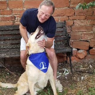 man smiling with dog